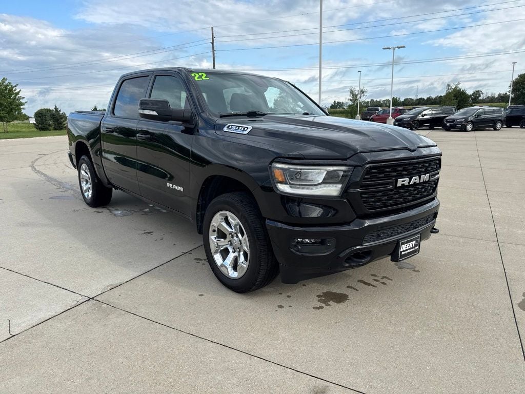 2022 RAM 1500 Big Horn Crew Cab 4x4 5'7' Box in Diamond Black Crystal Pearlcoat — front three-quarter view