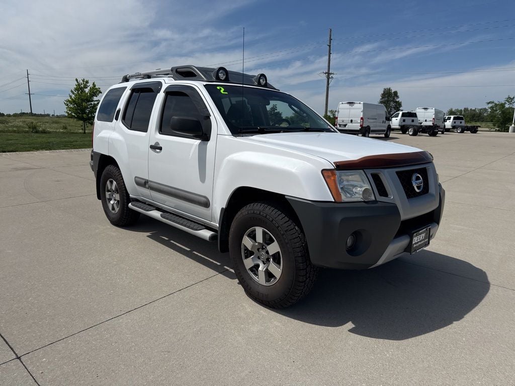 2012 Nissan Xterra PRO-4X in Avalanche Clearcoat — front three-quarter view